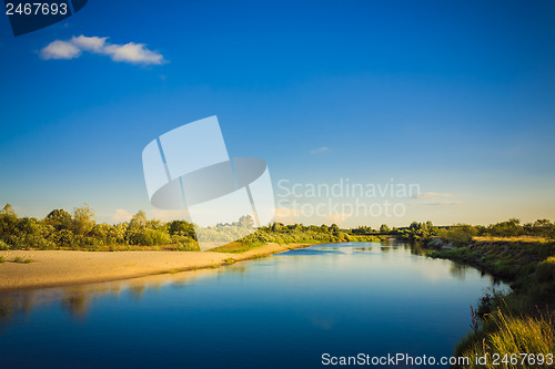 Image of Wide Panorama Of A River And The Forest