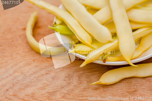 Image of Yellow Kidney Beans In A Bowl On Wooden Table