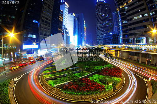 Image of Colorful city night with lights of cars motion blurred in hong k