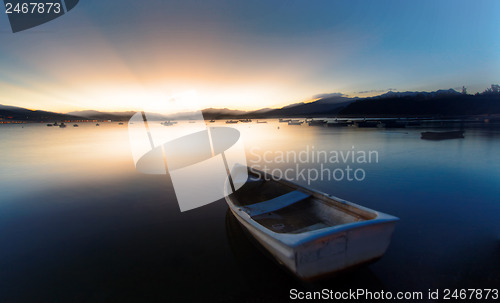 Image of sunset on the lake, boat 