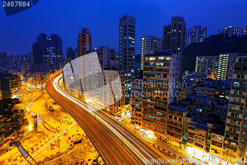 Image of Colorful city night with lights of cars motion blurred in hong k