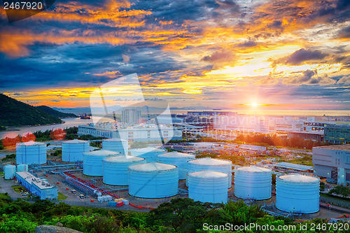 Image of Oil tanks at sunset