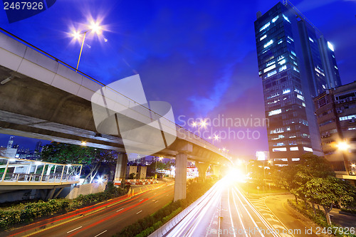 Image of moving car with blur light through city at night 