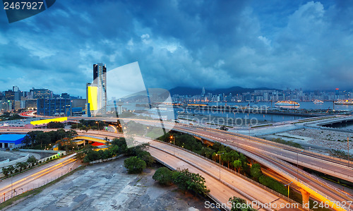 Image of highway bridge in city at cloudy night