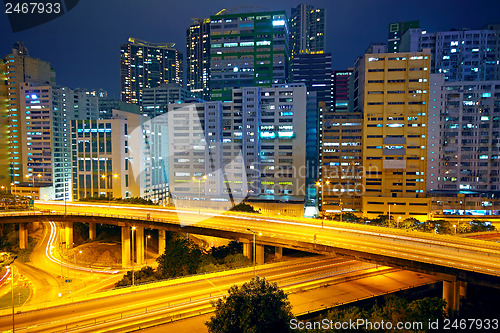 Image of urban area dusk, busy traffic 