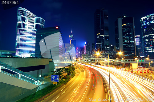 Image of Colorful city night with lights of cars motion blurred in hong k