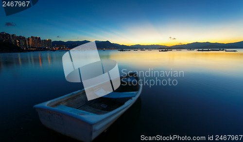 Image of sunset on the lake, boat 
