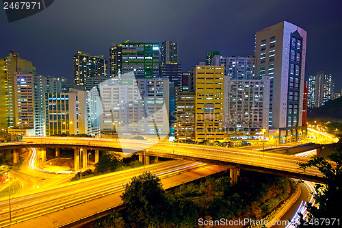 Image of Colorful city night with buildings and bridge