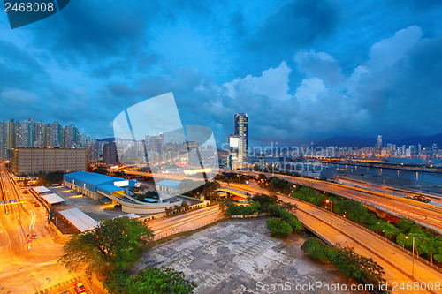 Image of highway bridge in city at cloudy night