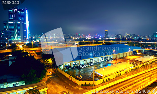 Image of urban landscape at night and through the city traffic 