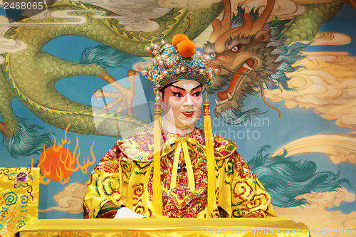 Image of chinese opera dummy and red cloth as text space ,it is a toy,not