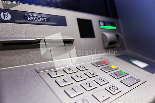 Image of Close up of an ATM machine. Keyboard and insert card 