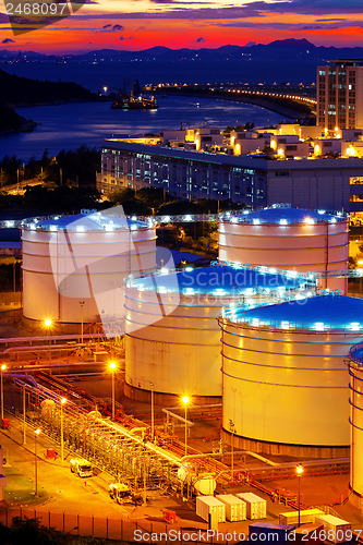 Image of Oil tanks at sunset