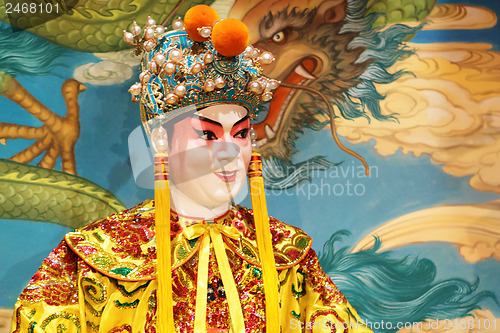 Image of chinese opera dummy and red cloth as text space ,it is a toy,not