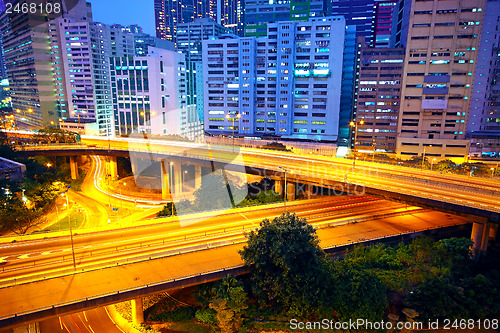 Image of urban area dusk, busy traffic 