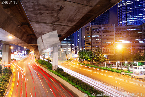 Image of moving car with blur light through city at night 