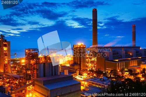 Image of coal power station and cement plant at night