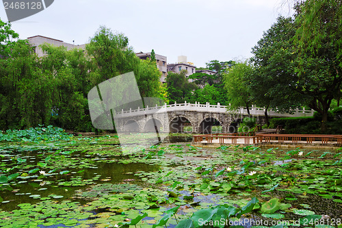 Image of stone bridge in an Asian garden 