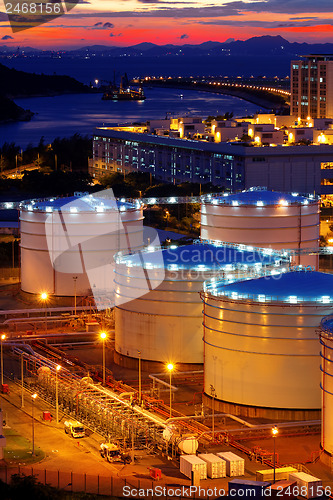Image of Oil tanks at sunset