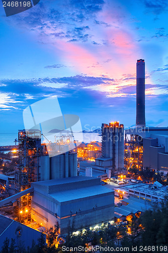Image of coal power station and cement plant at night