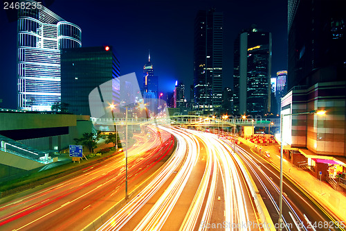 Image of Colorful city night with lights of cars motion blurred in hong k