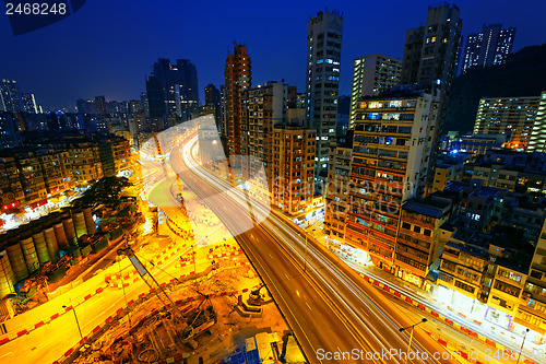 Image of Colorful city night with lights of cars motion blurred in hong k