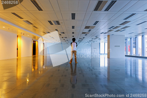 Image of Man stand in empty floor