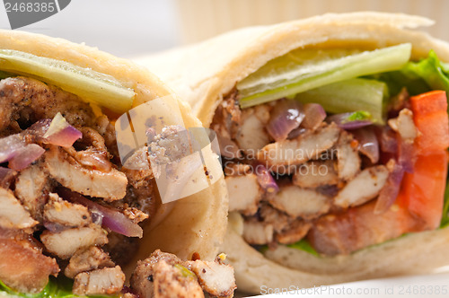 Image of kafta shawarma chicken pita wrap roll sandwich