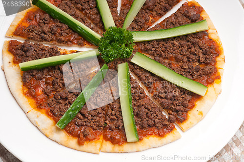 Image of Turkish beef pizza with cucumber on top