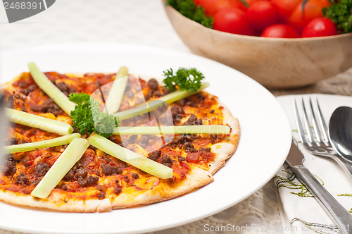 Image of Turkish beef pizza with cucumber on top