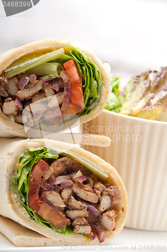 Image of kafta shawarma chicken pita wrap roll sandwich