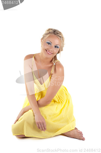 Image of Shot of beautiful woman in yellow dress
