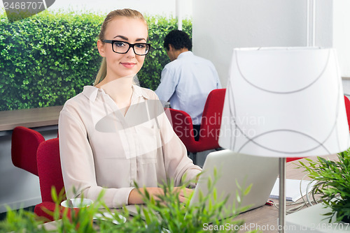 Image of Woman in a hot desk office