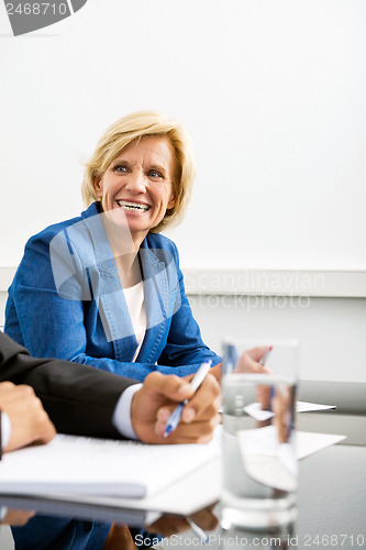 Image of Happy Businesswoman In Conference Room