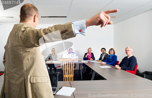 Image of Entrepreneur Giving Presentation To Colleagues