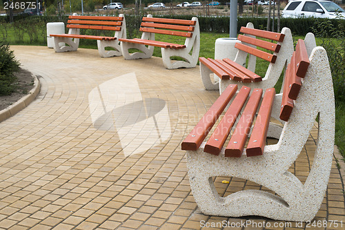 Image of Wooden benches in a park