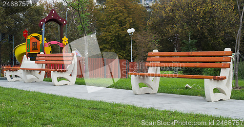 Image of Wooden benches in a park