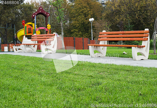 Image of Wooden benches in a park