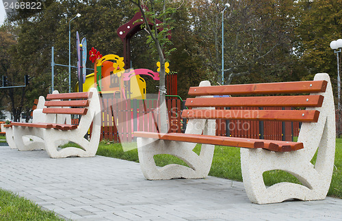 Image of Wooden benches in a park