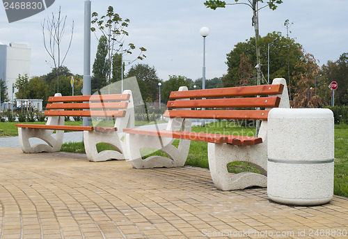 Image of Wooden benches in a park