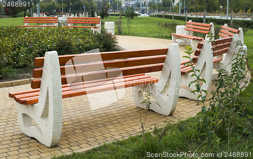 Image of Wooden benches in a park