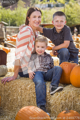 Image of Portrait of Attractive Mother and Her Sons at Pumpkin Patch
