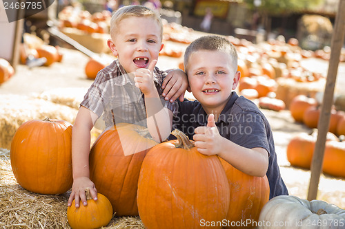 Image of Two Boys at the Pumpkin Patch with Thumbs Up