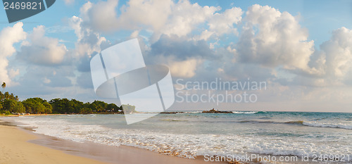 Image of Picturesque clouds over tropical beach