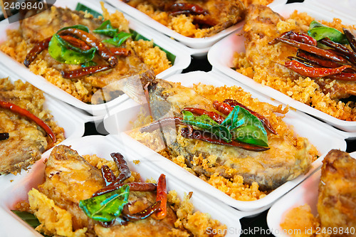 Image of Sweet and sour fish on the market close up