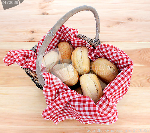 Image of Rustic picnic basket of fresh bread rolls