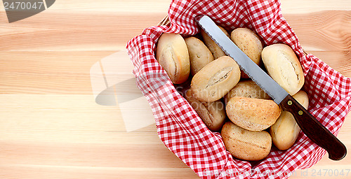 Image of Basket of petit pain and a bread knife 