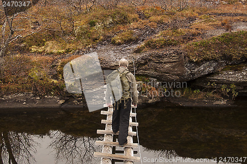 Image of Man on bridge