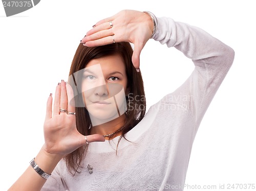 Image of Pretty woman with frame gesture