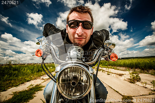 Image of Funny Biker racing on the road